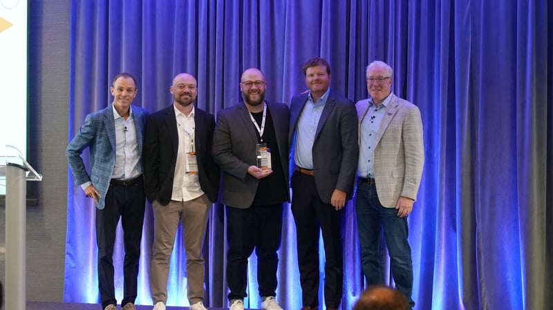 Next Level Solutions team accepting Duck Creek Partner of the Year: North America award alongside Duck Creek leadership