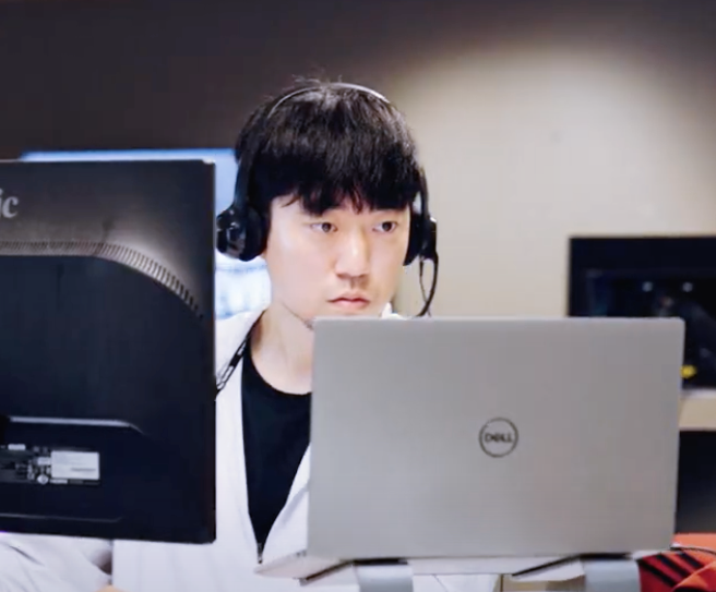 A man is using technology to work on insurance tasks with headphones on. A man is using technology to work on insurance tasks with headphones on.